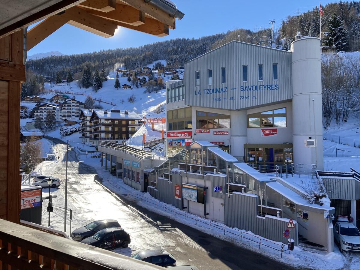A ski resort building with signage for 'La Tzoumaz' and 'SavoieRes.'