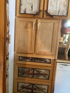 A wooden cabinet with two drawers and a built-in refrigerator. - Gorgeous 3-bedroom 3 bath Craftsman home north of Mt. Washington (Stark)