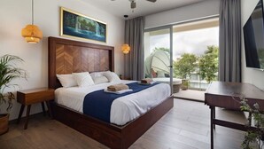 A modern hotel room with a large bed, a ceiling fan, a painting, and a balcony with a view. - Stylish Apt with Private Balcony, Pool and Gym (Playa del Carmen)