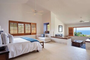 A bedroom with a bed, a desk, a chair, and a view of the ocean. - Four Seasons Villa Riva | 4BR Ocean-View Retreat w/ Infinity Pool & Golf Cart (Punta Mita)