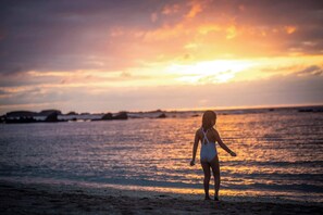 A person standing on a beach during sunset. - Luxury Golf-Front Villa: 6BR w/ Private Pool, Chef & Golf Cart (Punta Mita)