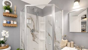 Shower, hair dryer, towels, soap