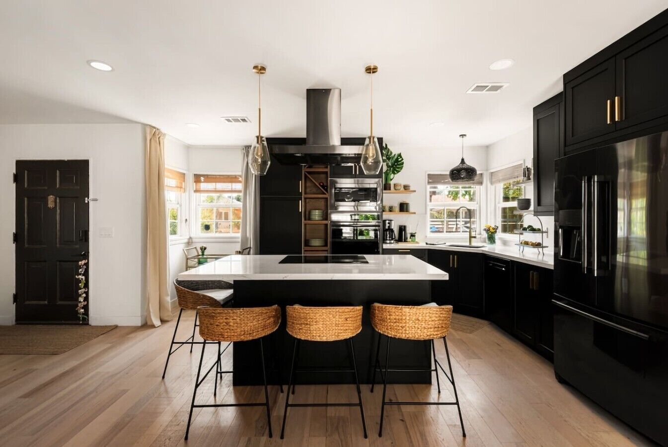 Fully equipped chef’s kitchen with a large island, modern appliances, and plenty of space for cooking and gathering.
