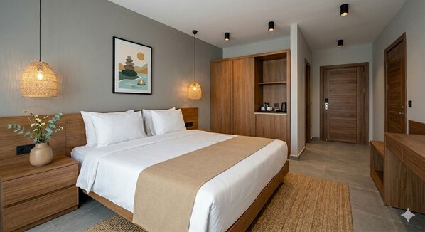 A modern bedroom with a large bed, wooden wardrobe, bedside tables, and a hanging light fixture.