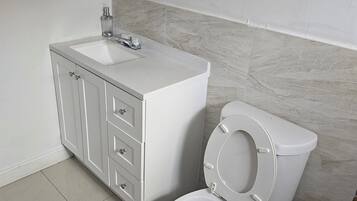 Hair dryer, towels, soap, toilet paper