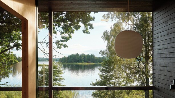 A room with a large window overlooking a lake, a round table, and a sofa. - Architect-designed cabin with Harefjord views (Säffle)
