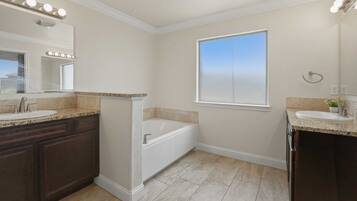 Combined shower/bathtub, hair dryer, towels, soap