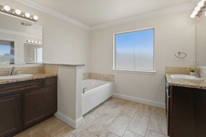 Combined shower/bathtub, hair dryer, towels, soap - Corporate Housing - Midland TX - ACOMM (Midland)