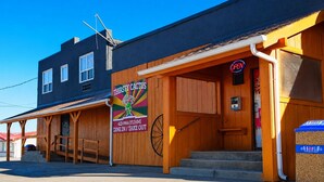 A building with a sign for 'Thirsty Cactus' offering dine-in and take-out services. - Ste Anne Hotel (Ste Anne)