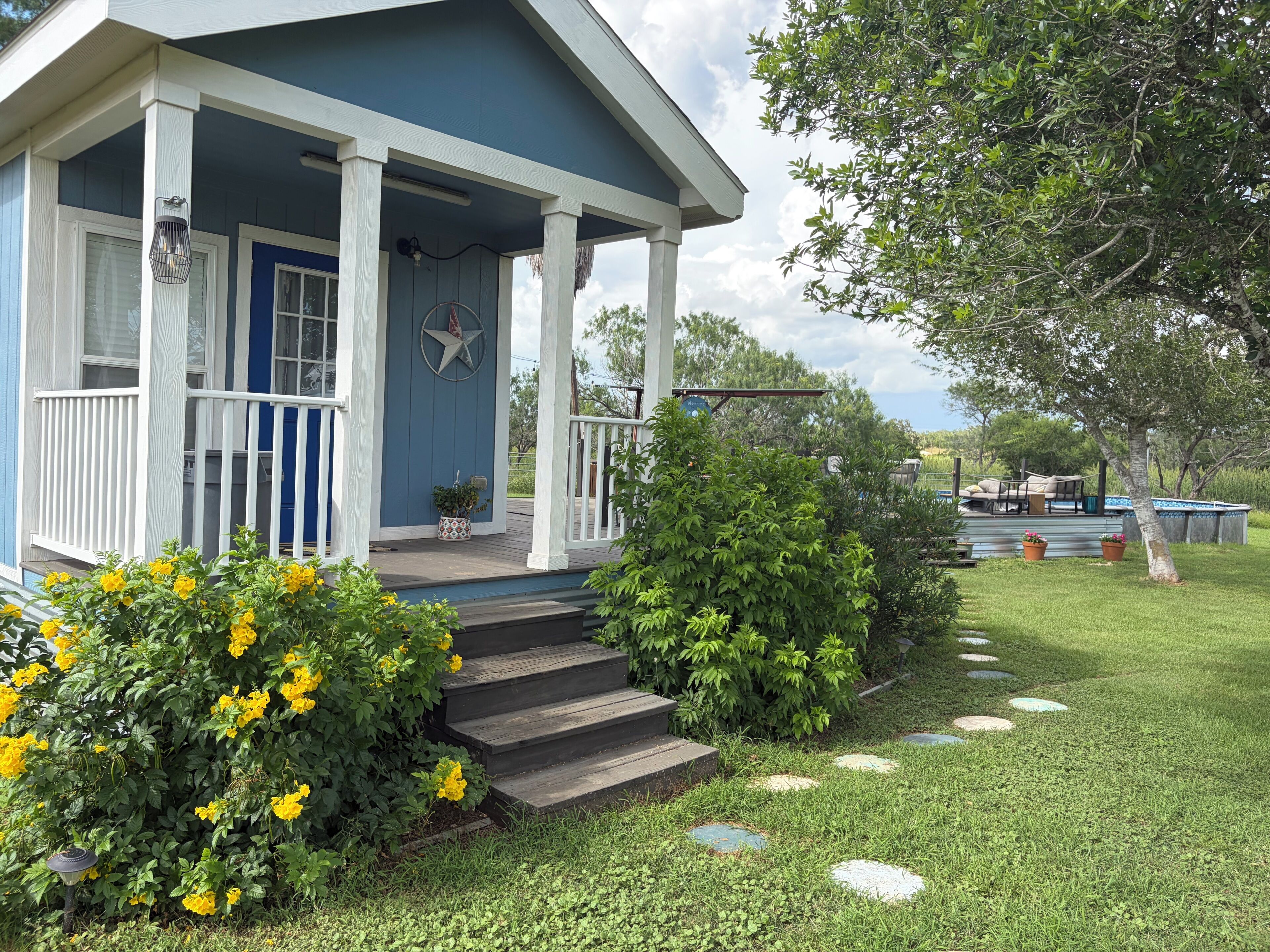 Exterior. Cozy 1-bedroom cottage in serene Jourdanton with private pool and deck.