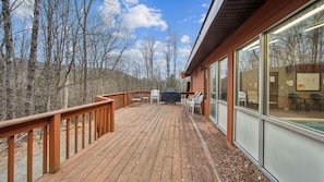 A wooden deck with outdoor seating and a barbecue grill. - Lower Sleighride by Avantstay Heated Pool + Rec Lounge Near Gore (North Creek)