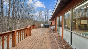 A wooden deck with outdoor seating and a barbecue grill. - Pete Gay by Avantstay Indoor Heated Pool + Rec Center Near Gore Mountain (North Creek)