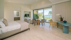 A bedroom with a bed, a desk, and a view of the ocean. - Shemesh Residence - Ocean Golf Views With Full Staff at Unique Cap Cana Villa (Punta Cana)