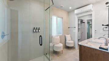 Shower, hair dryer, towels, soap