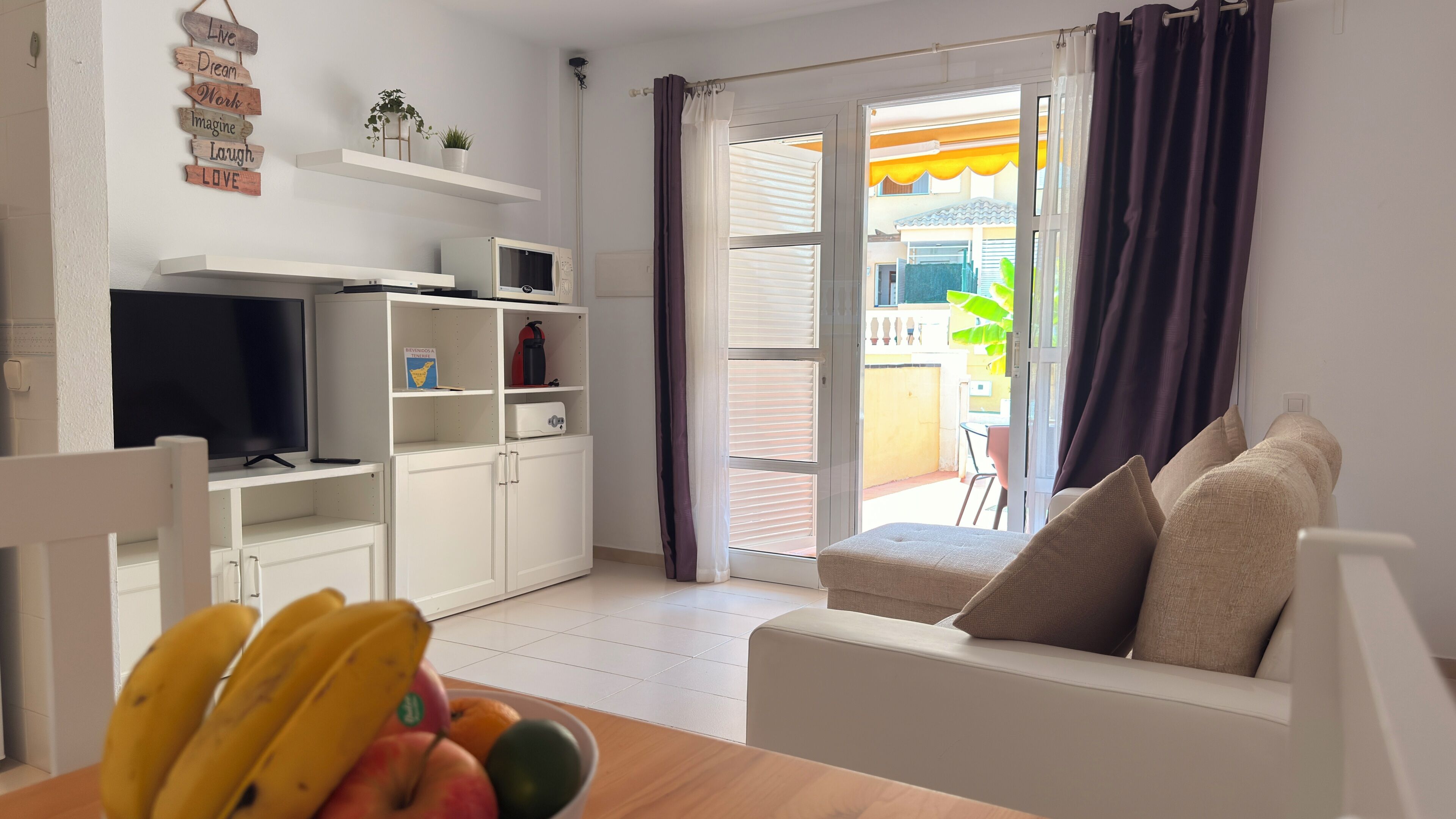Comfort Apartment | Living area | 50-inch flat-screen TV with digital channels