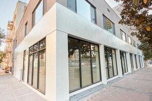 A modern building with large windows and a flat facade. - Broadway (San Diego)