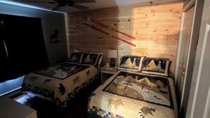 A bedroom with two beds, each with a unique animal-themed duvet cover. - Lies by Avantstay Indoor Heated Pool + Game Lounge Pool Table + Foosball (North Creek)