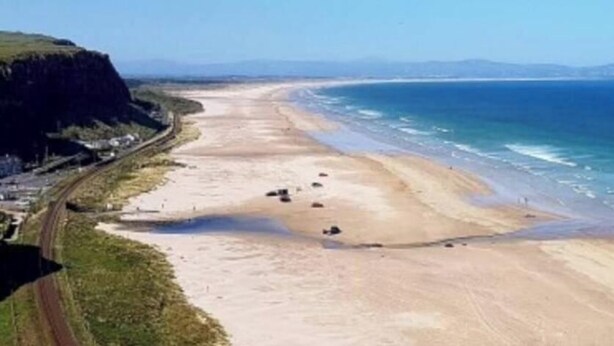 A coastal road with a beach and cliffs. - Beachfront Studio Suite Downhill Free Parking (Coleraine)