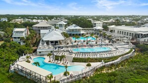 A resort with multiple swimming pools, lounge areas, and a view of the surrounding neighborhood. - STEPS to Camp WaterColor! LSV/Golf Cart & 4 Bikes Included! (Santa Rosa Beach)