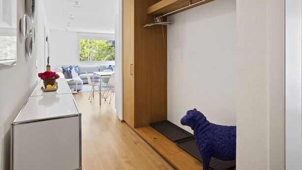 A modern interior with a dining area, a wooden cabinet, and a blue sculpture. - Liebrand Appartement/Fewo Ferienwohnung Liebrand by Interhome (Churwalden)