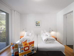 A hotel room with two beds, a large window, a painting on the wall, and a balcony. - Liebrand Appartement/Fewo Ferienwohnung Liebrand by Interhome (Churwalden)