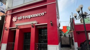 A red building with a sign reading 'El TeapaneCo' and a gated entrance. - LOFT. 5 Next to CERACOM and 500 m from Plaza Crystal. (Villahermosa)