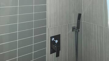 Shower, towels, soap, toilet paper