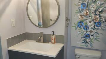 Shower, towels, soap, toilet paper
