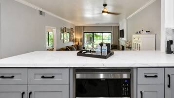 Coffee/tea maker, fridge, microwave, oven