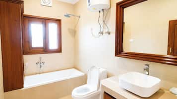 Shower, rainfall showerhead, slippers, towels