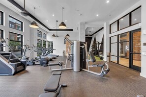A gym with treadmills, weight machines, and benches. - FriscoSquare+Gym+ToyotaStadium+Pool+PGAGolf+W+D (Frisco)