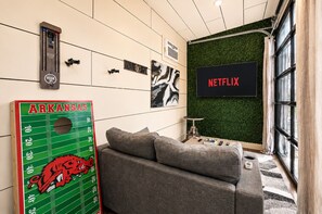 Games room - The Amp House.  #1 Tiny House in America. Barrel Sauna + Hot Tub (Fayetteville)