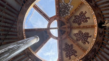 A circular architectural feature with intricate patterns and a central opening.