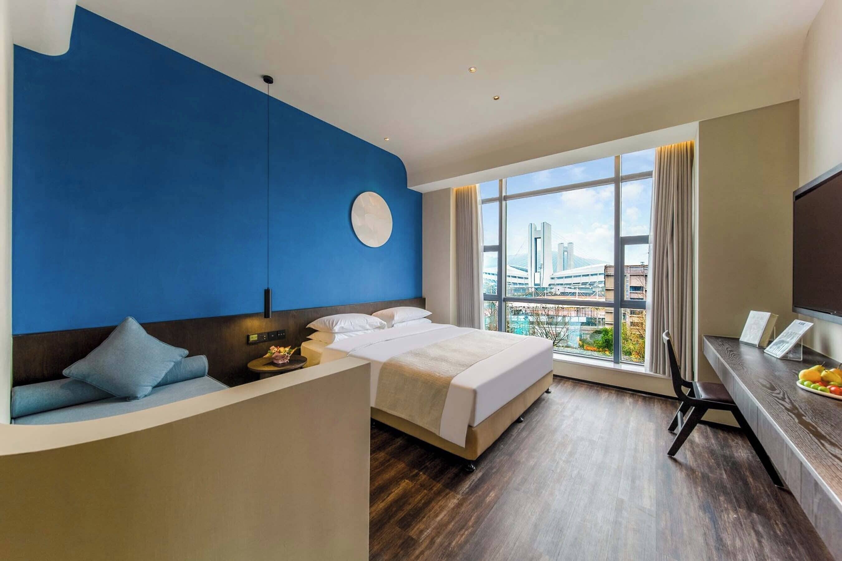 Family Twin Room | Down comforters, minibar, desk, laptop workspace