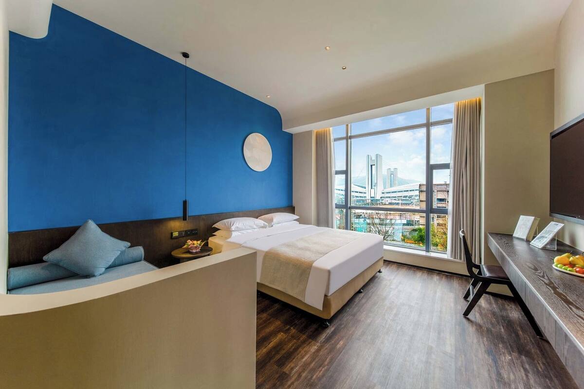 Family Twin Room | Down comforters, minibar, desk, laptop workspace