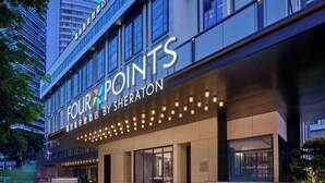 A hotel exterior with a prominent sign reading 'FOUR POINTS BY SHERATON' and a series of lights along the entrance. - Four Points by Sheraton Shenzhen Nanshan (Shenzhen)