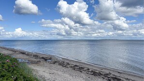 A coastal landscape with a clear sky, calm sea, and a rocky shoreline. - Pet friendly home in Nykøbing M with WiFi (Nykøbing M)