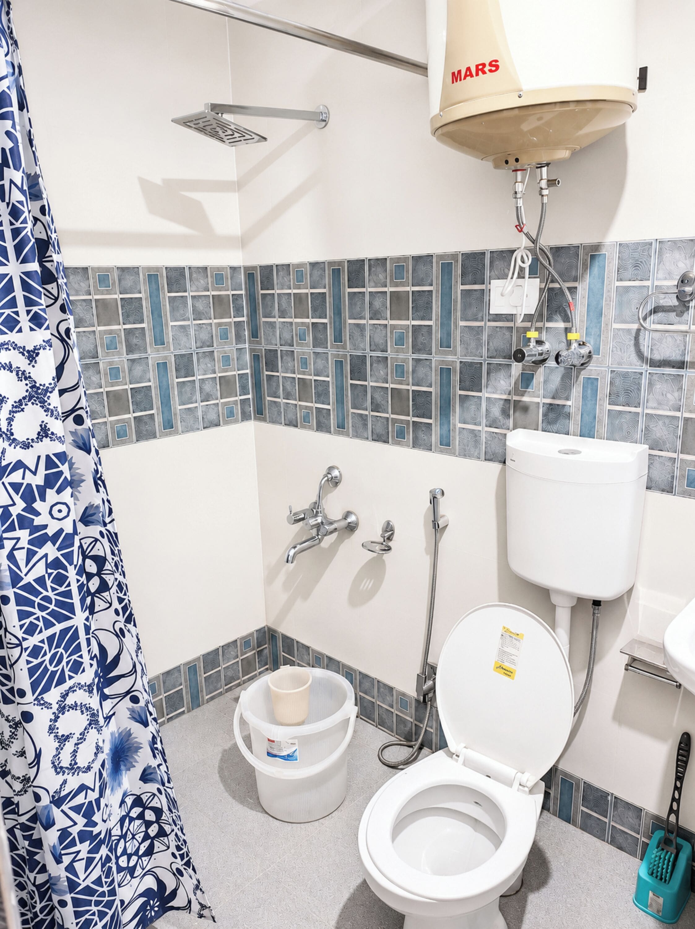 Shower, rainfall showerhead, slippers, towels