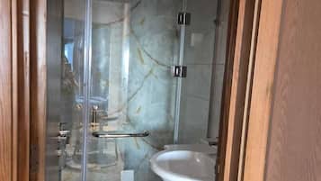 Shower, towels, soap, toilet paper