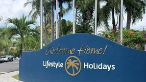 A blue sign with 'Welcome Home! Lifestyle Holidays' and a palm tree logo. - All inclusive paid at the resort  (Puerto Plata)