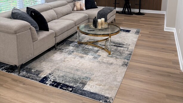 A modern living room with a sectional sofa, a glass coffee table, and a dining area with a table and chairs. - Welcome to Sandtown Villa—your home away from home. (Atlanta)