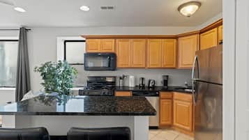 Apartment, 2 Bedrooms | Private kitchen | Coffee/tea maker, dining table
