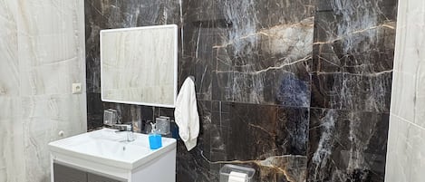 Shower, hair dryer, towels, soap