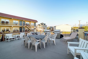A patio area with outdoor seating, a grill, and a poolside view. - 2 Blocks to Ocean! North Wildwood Family Getaway (North Wildwood)