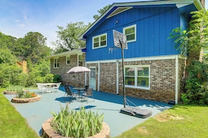 A blue house with a patio, outdoor furniture, and a mailbox. - 7 Mi to Stone Mtn Park! Spacious Family Getaway (Lilburn)
