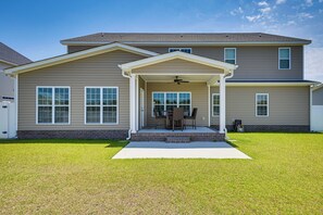 A two-story house with a covered porch, a brick foundation, and a lawn. - 6 Mi to Medical District: Spacious Winterville Gem (Winterville)