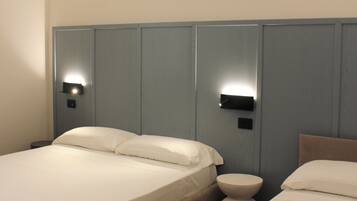 Deluxe Triple Room | In-room safe, desk, laptop workspace, blackout drapes