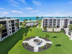 A hotel with multiple floors, a pool, and a beach view. - Welcome to F203, 2br/2bath, Sundial of Sanibel, a relaxing beach condo, resort-style amenities, and easy access to sand, shells, dining, and island fun. Perfect for a Sanibel getaway with comfort, convenience, and coastal charm. 3-7night minimum (Sanibel Island)