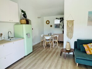 A compact living space with a kitchenette, dining area, and seating area. - Magnificent, peaceful ground floor villa with unobstructed view. Ideal for families (Sainte-Maxime)