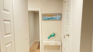 A hallway with wooden flooring, white walls, and a ceiling with recessed lighting. - San Destin Dream Vacation 3-bedroom townhome in beautiful Santa Rosa Beach. (SANTA RSA BCH)